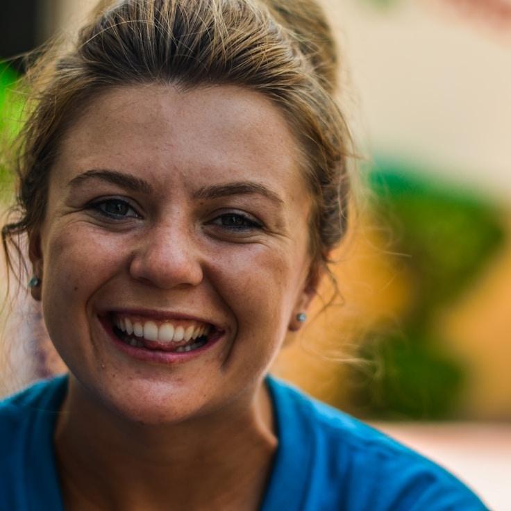 Priya Kapoor, Lead Design Curator at Leaf Bench Nimbus, reviewing corporate floral arrangements